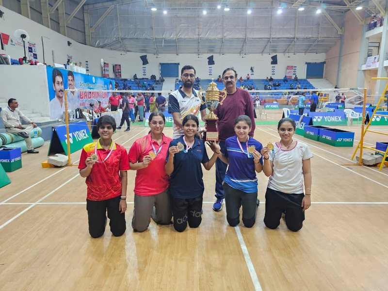 Punjab's U-19 girls team with gold medals and trophy on court in Vijayawada